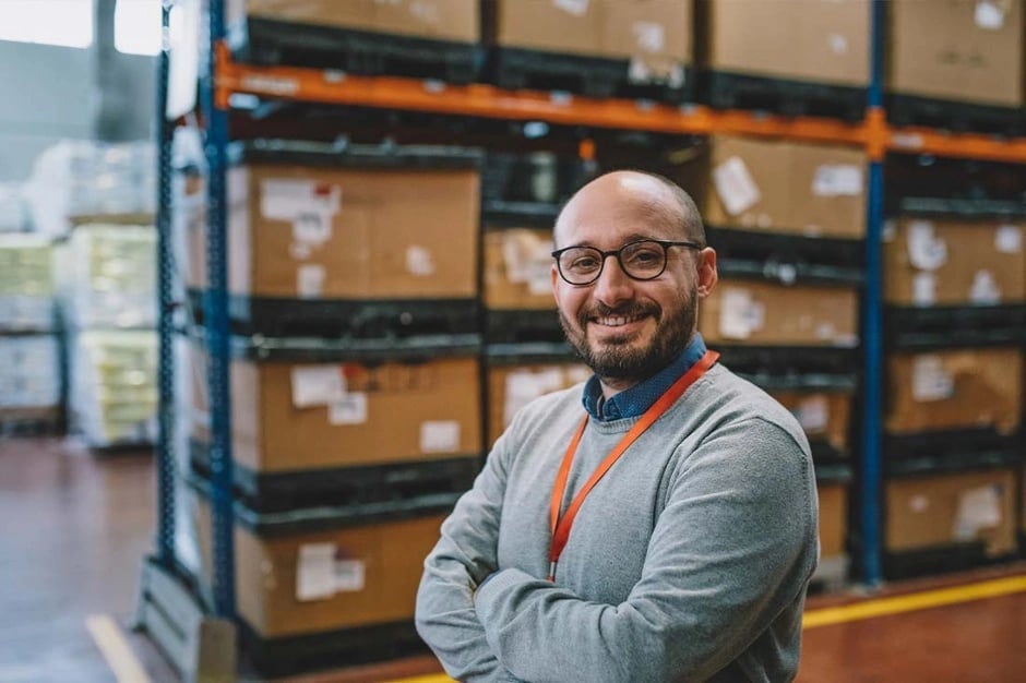 chief-operating-officer-in-warehouse-smiling-940