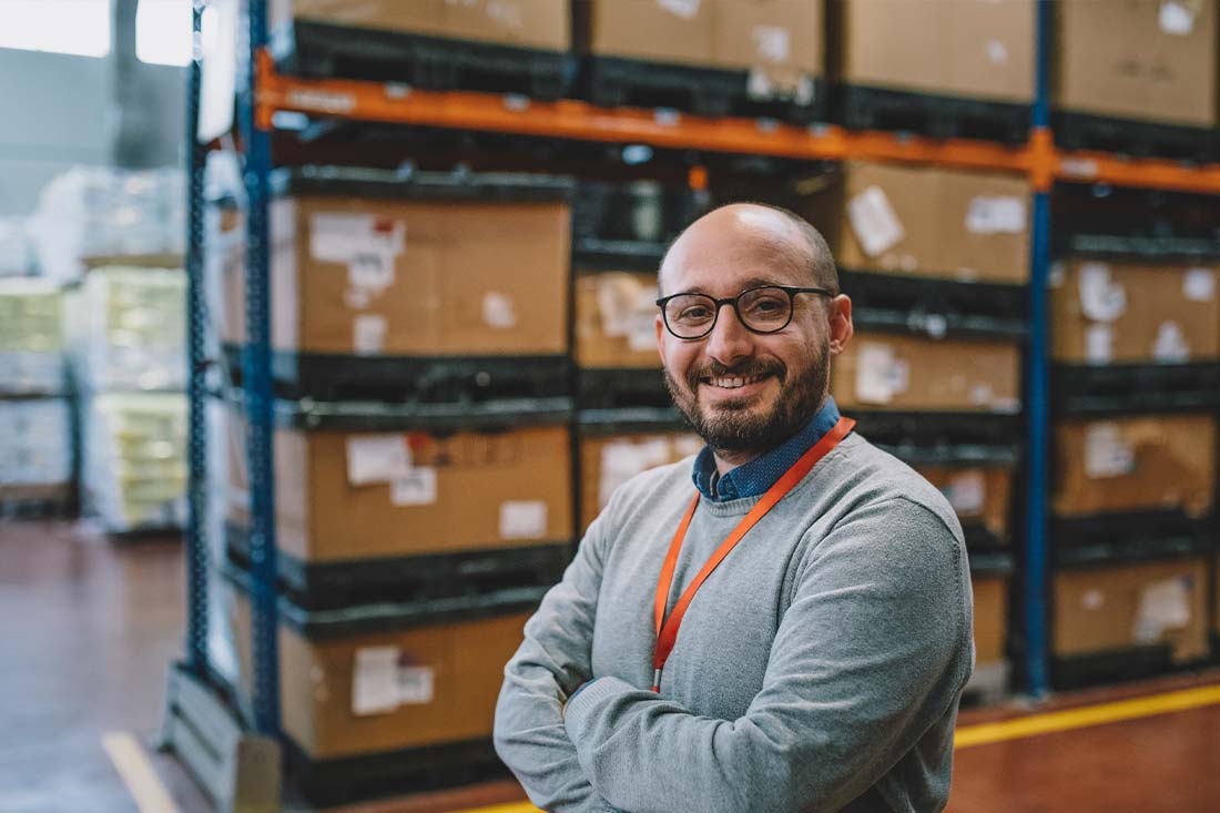chief-operating-officer-in-warehouse-smiling