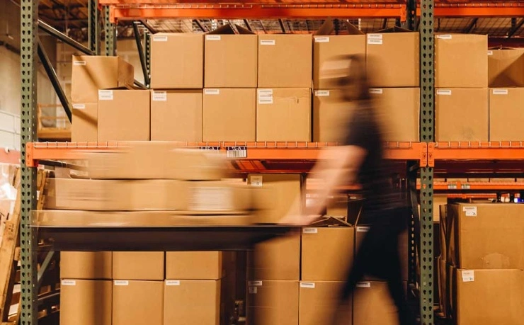 walking-quickly-through-warehouse-with-cart-740